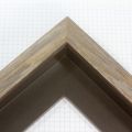 This rustic grey and brown floater frame features a 1 " profile and 1 " depth. This simple frame is elevated by the visible natural wood grain.