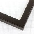 A simple 1-1/4 " wood frame features a smooth texture that enhances the dark black finish.